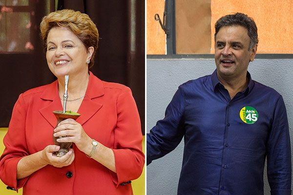 Dilma Rousseff e Aécio Neves durante votação / AFP
